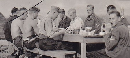 Flak site with men taking rest from building